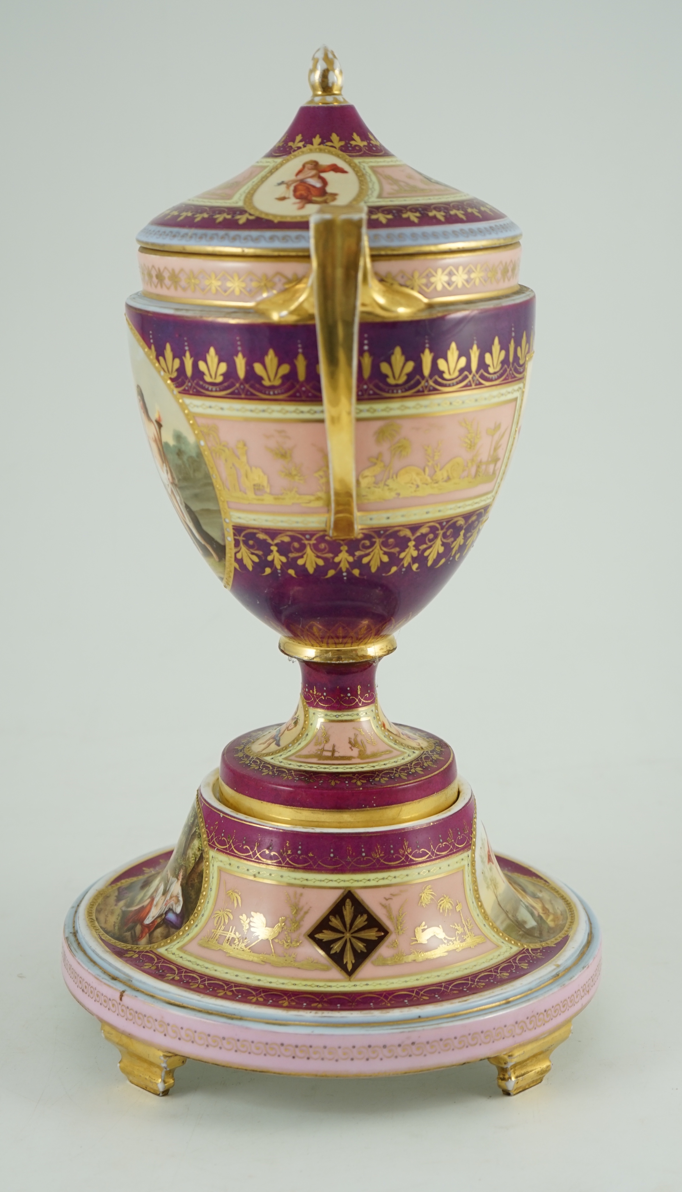 A Vienna style porcelain two handled cup, cover and stand, late 19th century, 42 cm high